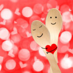 smiley painted on spoons, valentines day background
